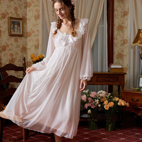 Full-length pink nightgown view highlighting the airy mesh overlay and flowing tiered skirt
