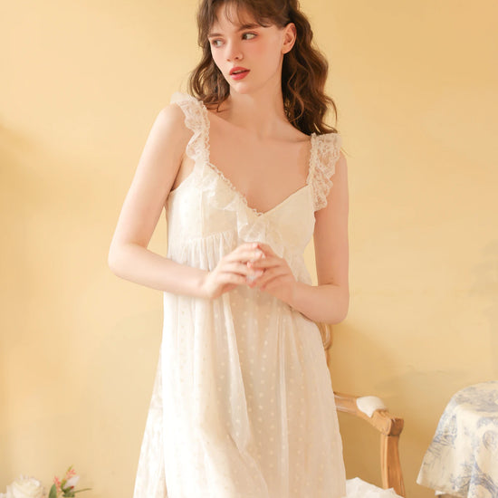Front view of the white cami nightdress highlighting its gathered V neckline and embroidered mesh