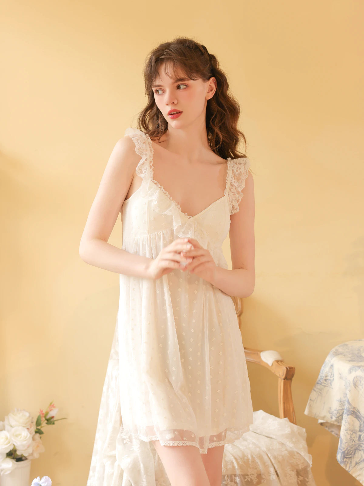Front view of the white cami nightdress highlighting its gathered V neckline and embroidered mesh