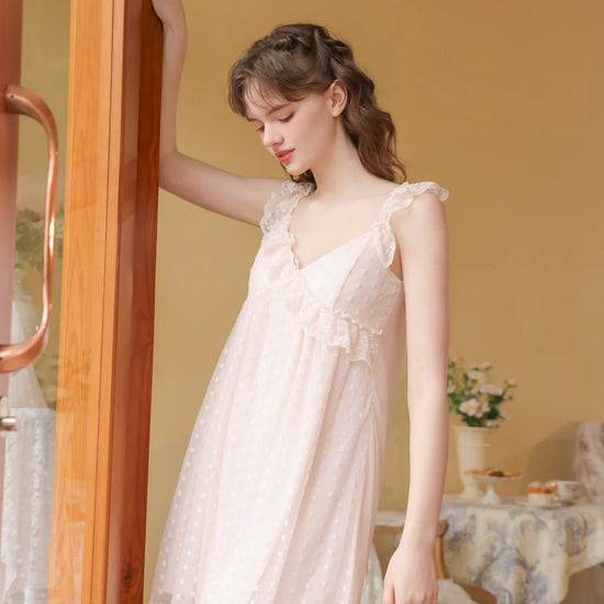 Full-length pink nightdress view highlighting the airy mini silhouette and delicate lace trim