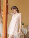 Full-length pink nightdress view highlighting the airy mini silhouette and delicate lace trim
