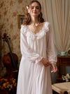 Light pink mesh nightgown front view showing the ruffled lace neckline, small rose bow, and sheer gathered sleeves