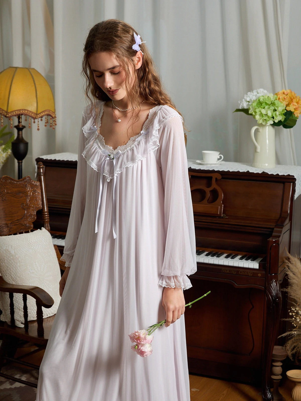 Closer angled view of the light purple nightgown showing the scalloped lace neckline, layered mesh ruffles, and gathered cuffs