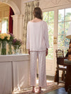 Back view light pink long sleeve pajama set with full-length printed pants