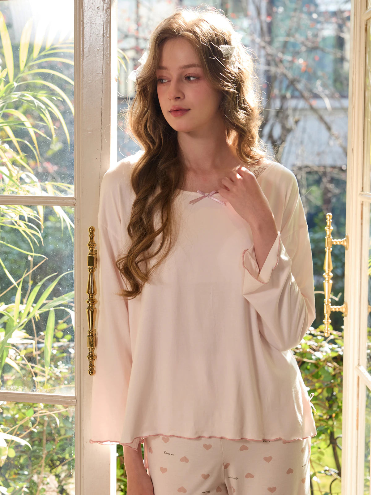 Light pink pajama set with bow neckline and soft viscose drape