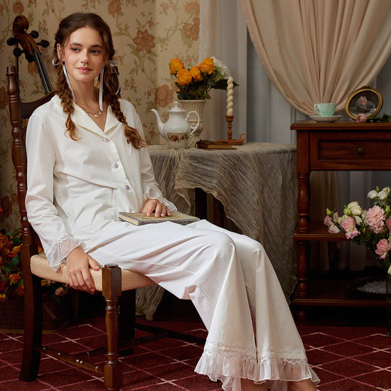 White cotton-blend pajama set styled seated to show the lace collar and relaxed fit
