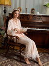Pink ruffle lace button-down pajama set shown from the front with matching full-length pants