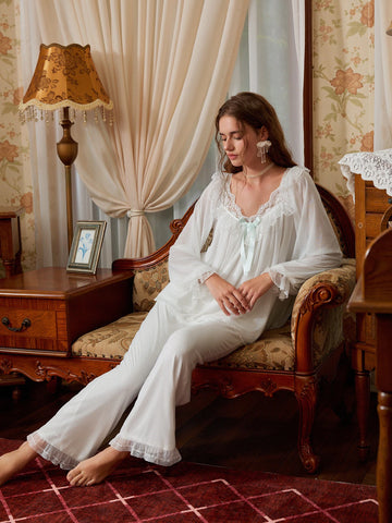 White sheer lace ruffle pajama set shown from the front with long sleeves and full-length pants