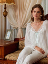 Full-length white pajama set view showing the soft lined top and lace-edged pant hems