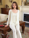 White three-piece floral pajama set shown with button cardigan, camisole, and full-length pants