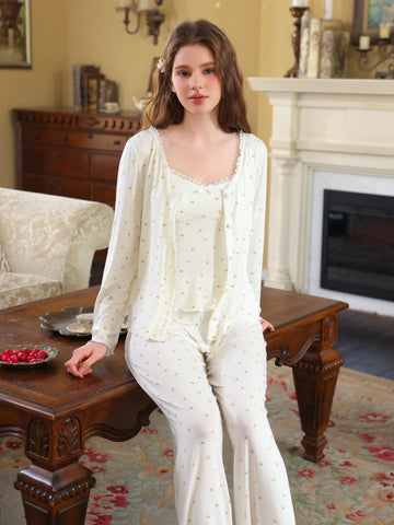 White three-piece floral pajama set shown with button cardigan, camisole, and full-length pants