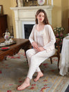 Light pink three-piece floral pajama set shown from the front with cardigan, cami, and pants