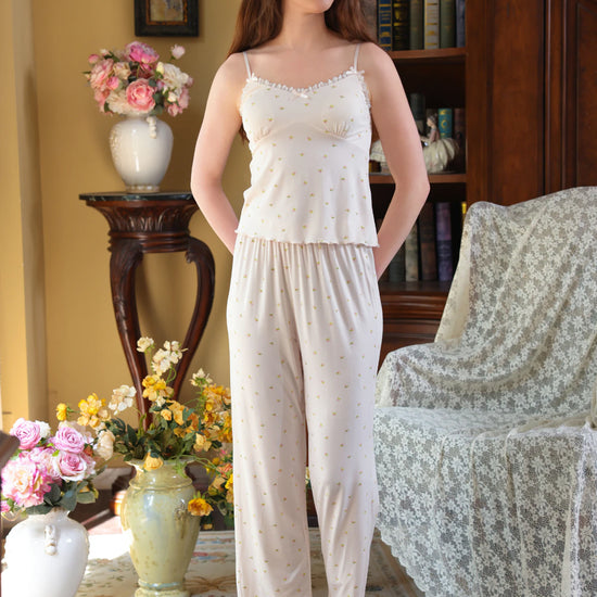 Full-length light pink floral pajama set styled to show its relaxed layered silhouette