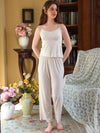 Full-length light pink floral pajama set styled to show its relaxed layered silhouette
