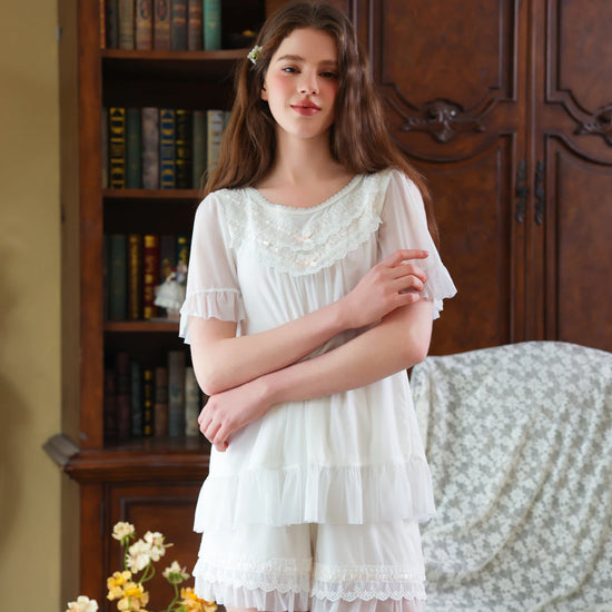 White lace ruffle short pajama set shown from the front with flutter sleeves and soft lining