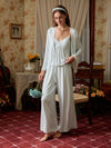 Light blue three-piece pajama set shown full length with lace-trim cami, open cardigan, and wide-leg pants