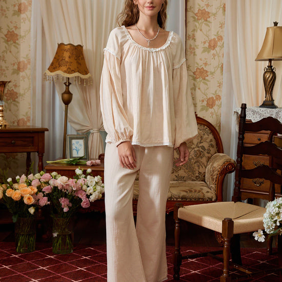 Light yellow cotton pajama set shown full length with a gathered round-neck top, balloon sleeves, and wide-leg pants