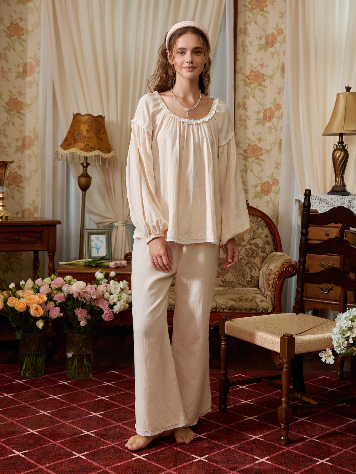 Light yellow cotton pajama set shown full length with a gathered round-neck top, balloon sleeves, and wide-leg pants