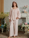 Full-length front view of the light pink cotton pajama set with a loose gathered top and lace-trimmed wide-leg pants