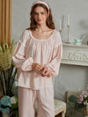 Light pink cotton pajama top shown closer to highlight the round lace neckline, balloon sleeves, and gathered cuffs