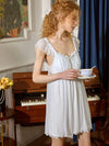 Close-up of SlesSic mesh sleep dress with ruffle sleeves and bow details